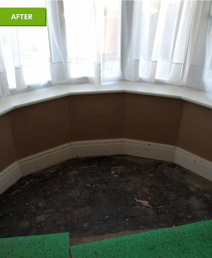 Living room bay window damp - Finished, membrane,boarded and plastered ready to dry out, skirting boards re fitted
