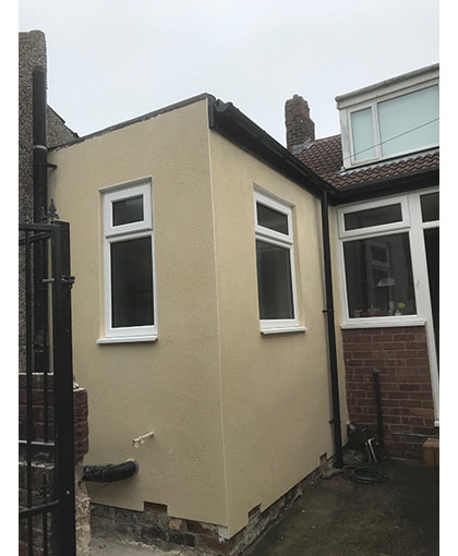 Coloured Render - Black facia and guttering with cream Webber render in cullercoats totally transformed back yard
